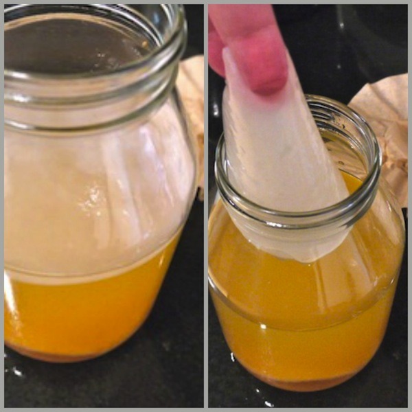 The white film is a SCOBY - symbiotic culture of bacteria and yeast. Use it to make more raw apple cider vinegar.