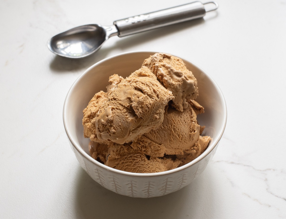Dandelion root coffee ice cream in bowl with scooper